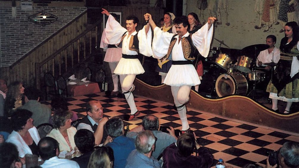 Charger l’élément 2 sur 10. Traditional Greek dancers onstage during a dinner show in Athens