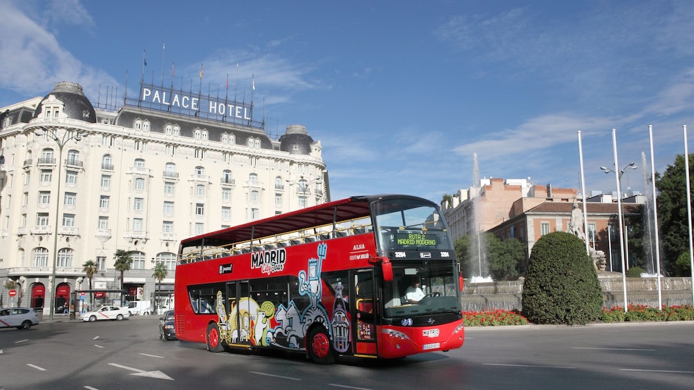 Red double-decker hop-on hop-off bus of Madrid with great views of the city 