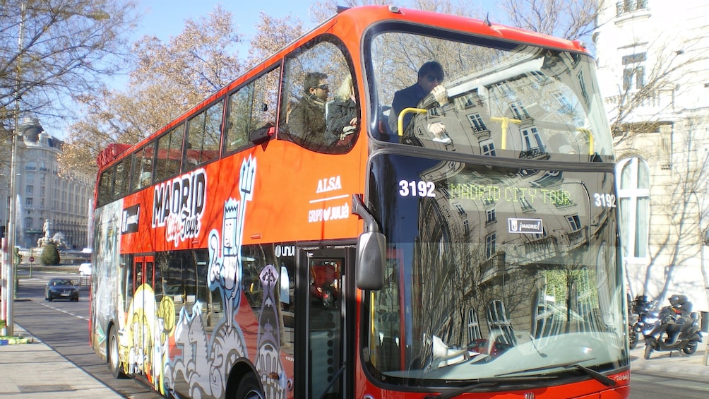 Red double-decker hop-on hop-off bus in Madrid