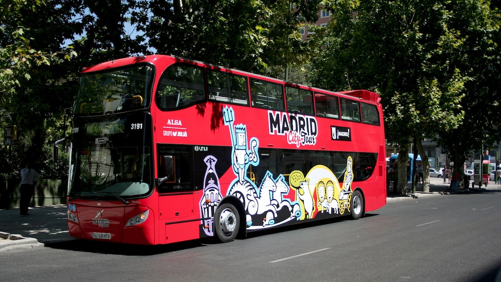 Red double-decker hop-on hop-off bus in Madrid