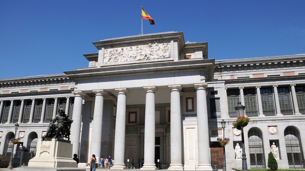 Image of people walking into the Museo del Prado the main Spanish national art museum in Madrid