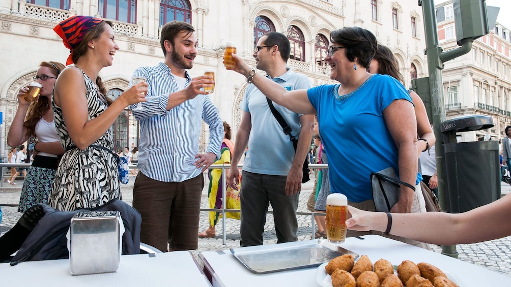 Friends toasting with a few pints of beer