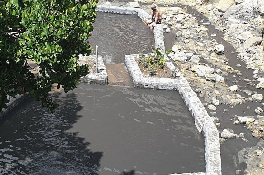 Black water pool at the sulphur springs where you can go for a mud bath