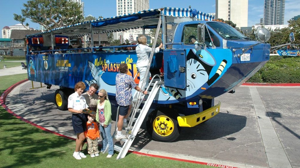 People getting onto the hydra terra amphibious vehicle ladder on land in San Diego