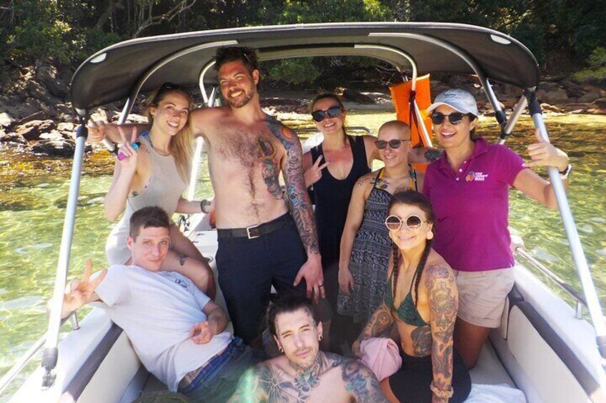 Group having fun on speedboat type one and large van. 