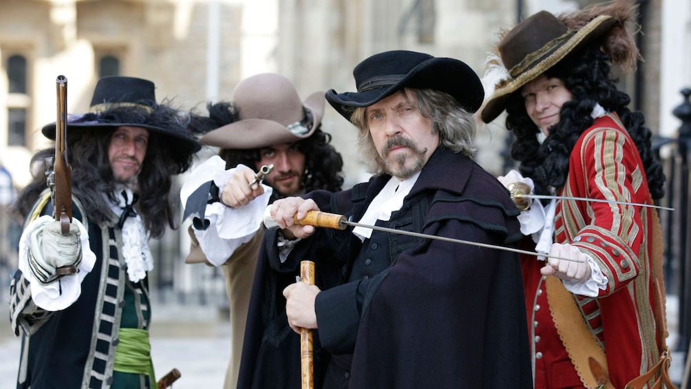 Character actors with sabers and pistols in Tower of London