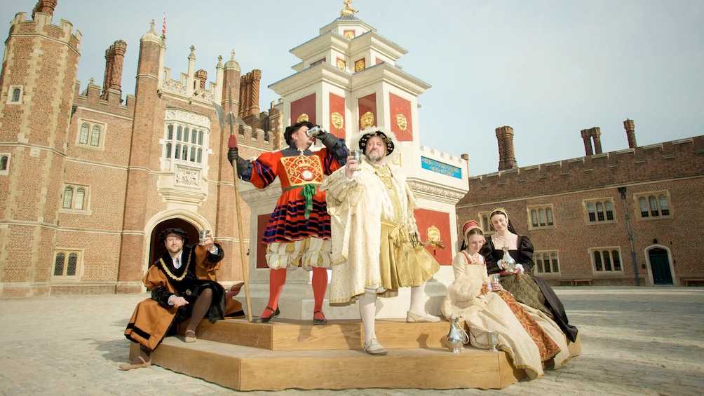 character actors portray historical figures at Hampton Court palace in London