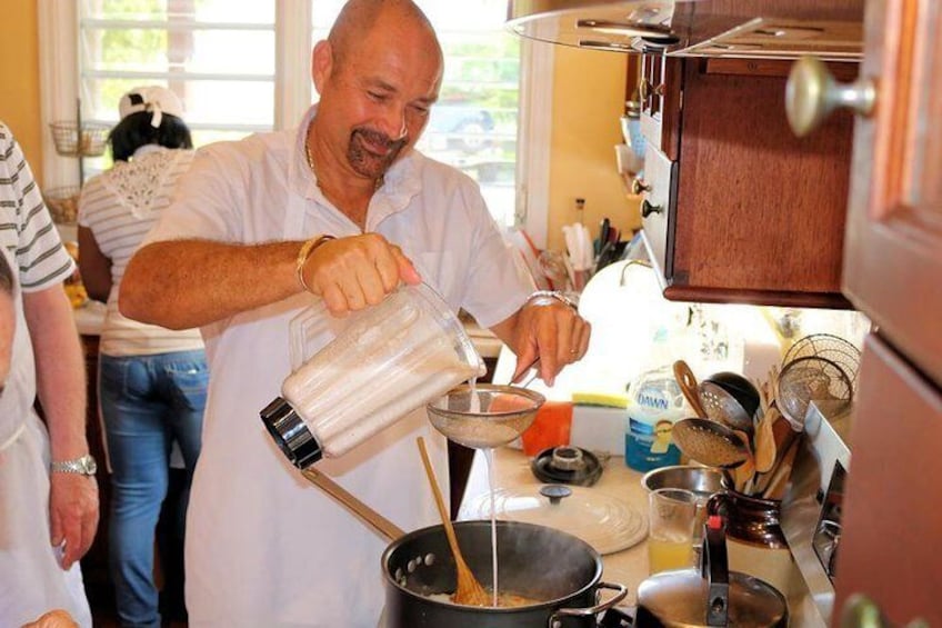 Straining coconut milk into rice.