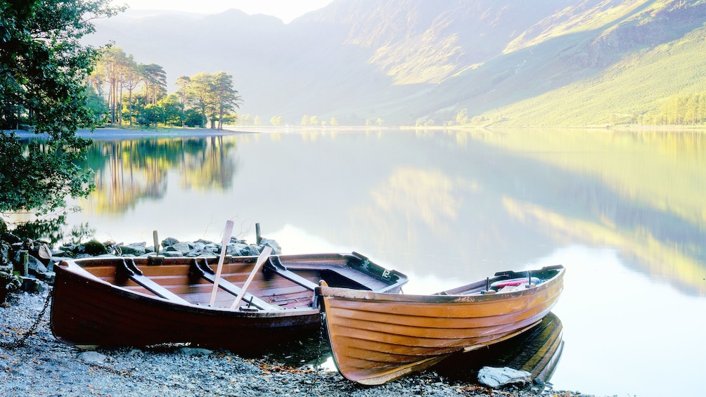 two canoes beached on shore of lake in London