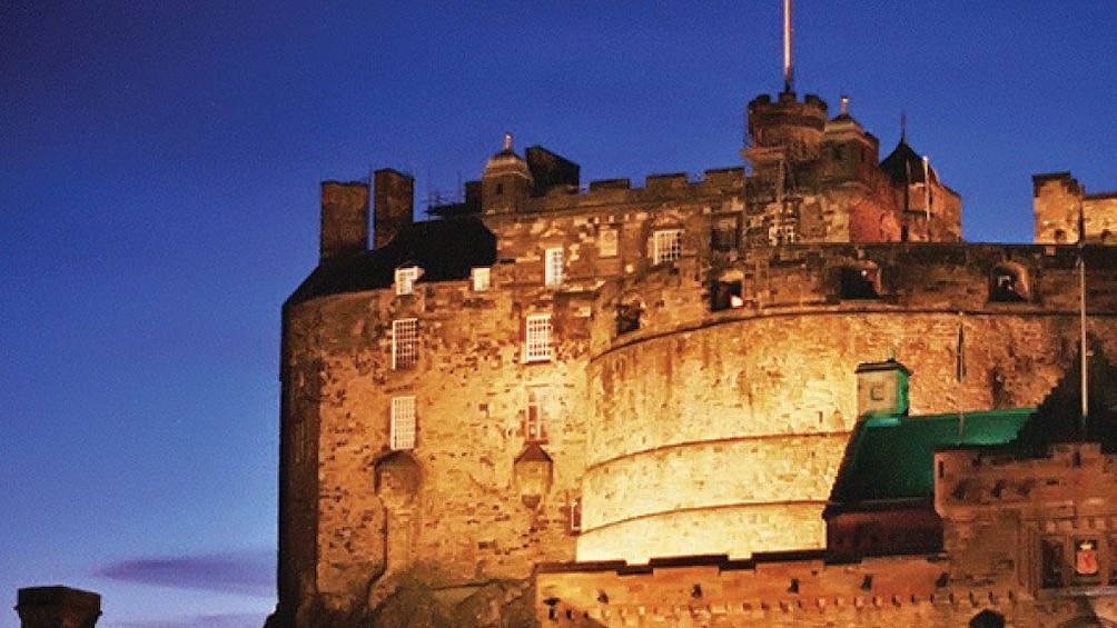 Edinburgh Castle lit up at night in London