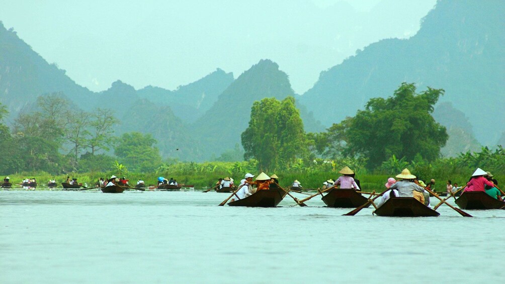 group of people rowing boats in Vietnam