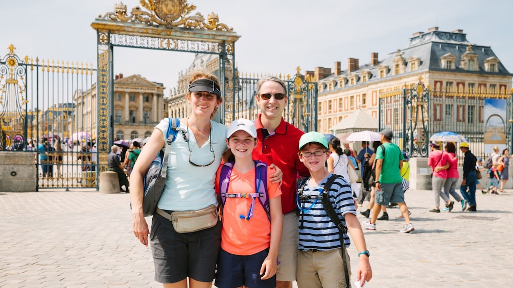 Family outside the gates of Versailles.