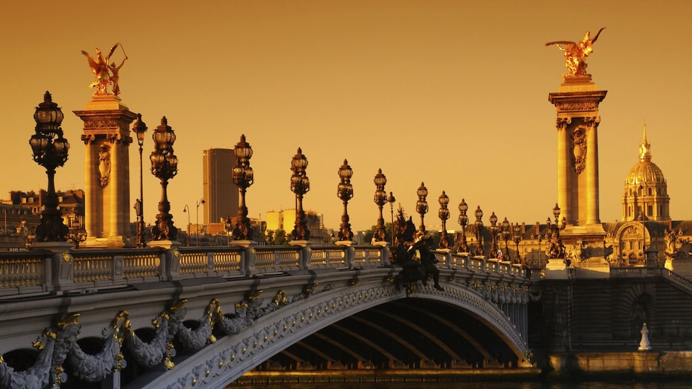 Ornate bridge on the Seine river at sunset. 
