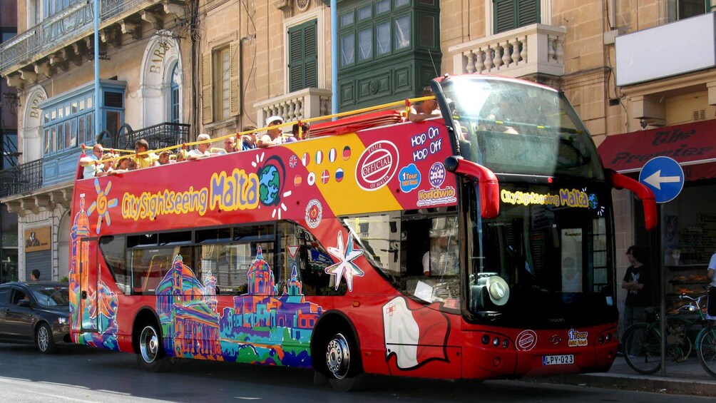 City Sightseeing bus touring down the streets of Malta