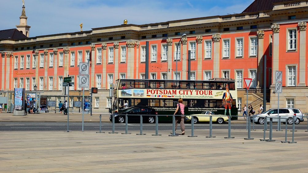 Tour bus traveling down the streets of Potsdam