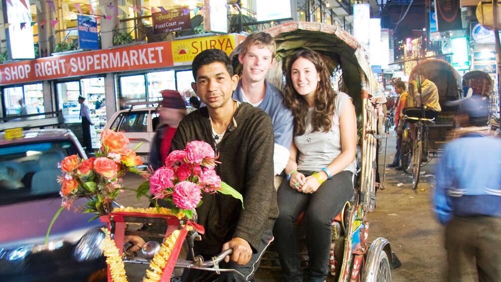 Couple on a cyclo at night around the Durbar Square in Kathmandu