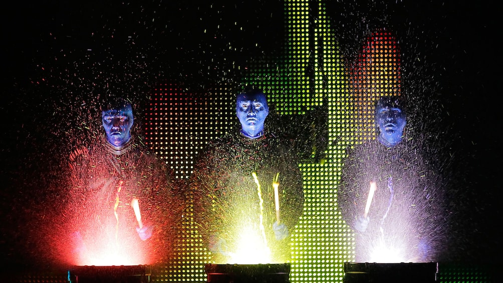 blue man group drumming with paints and light in chicago 