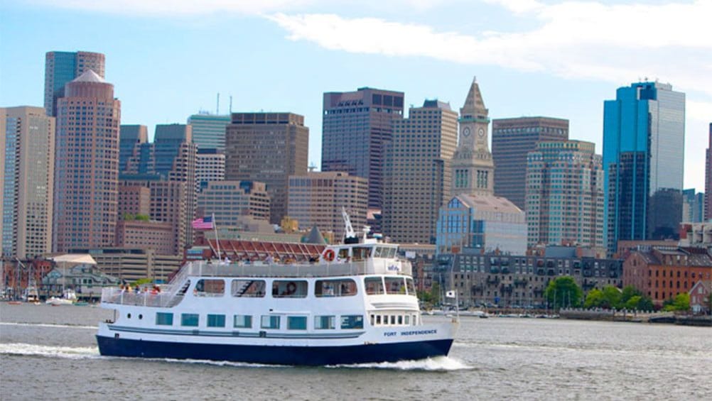 Boston Harbor Cruise boat with the skyscrapers of the city in the background in Boston