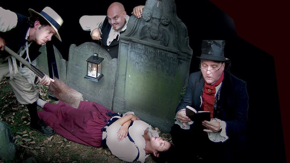 Ghosts and Gravestones Tour guides in costume in a graveyard scene in Boston