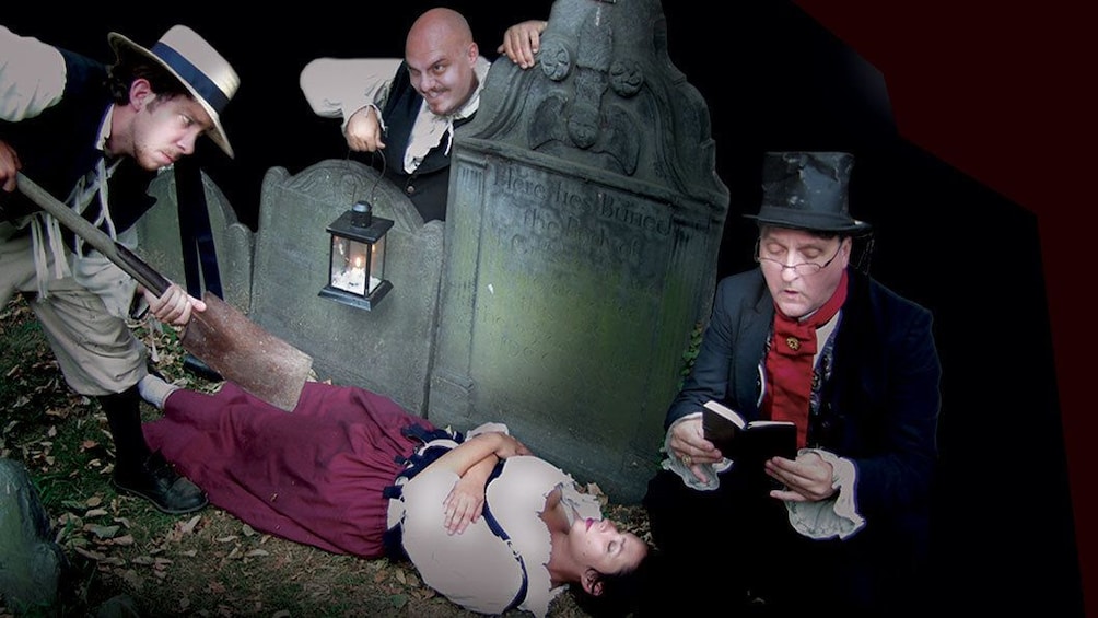 Ghosts and Gravestones Tour guides in costume in a graveyard scene in Boston