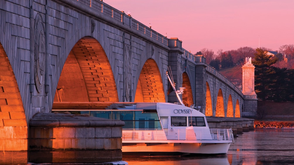 The Odyssey of Washington cruise ship under a bridge in Washington DC