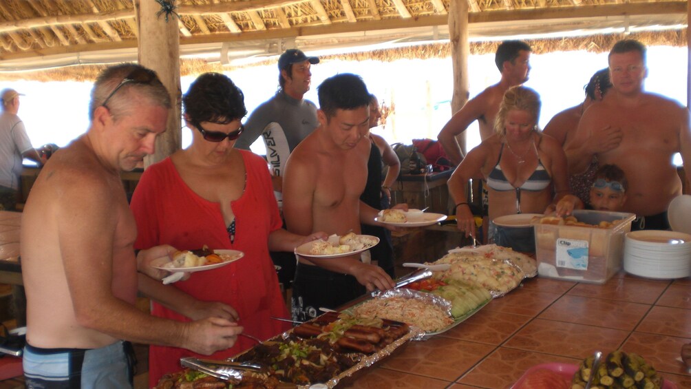 enjoying lunch under a sheltered establishment in Fiji