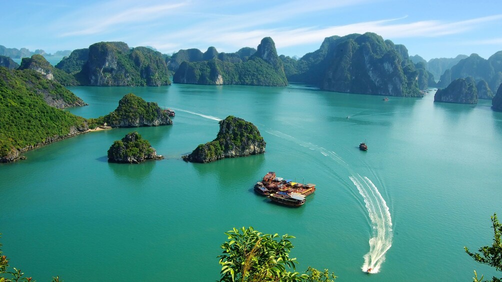 Jet boat speeding past small islands in Vietnam