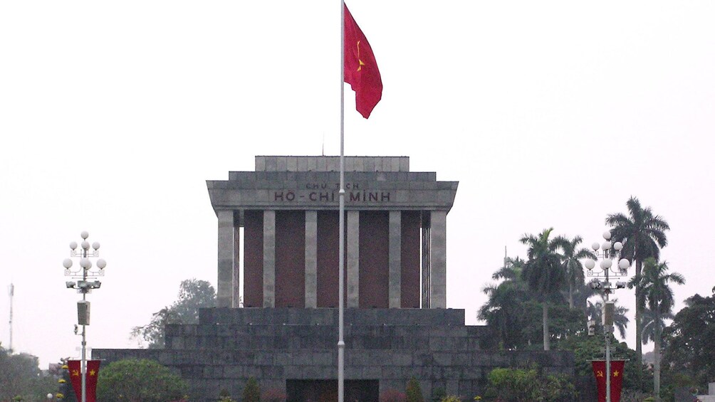 raised flag at the The Ho Chi Minh Mausoleum in Vietnam