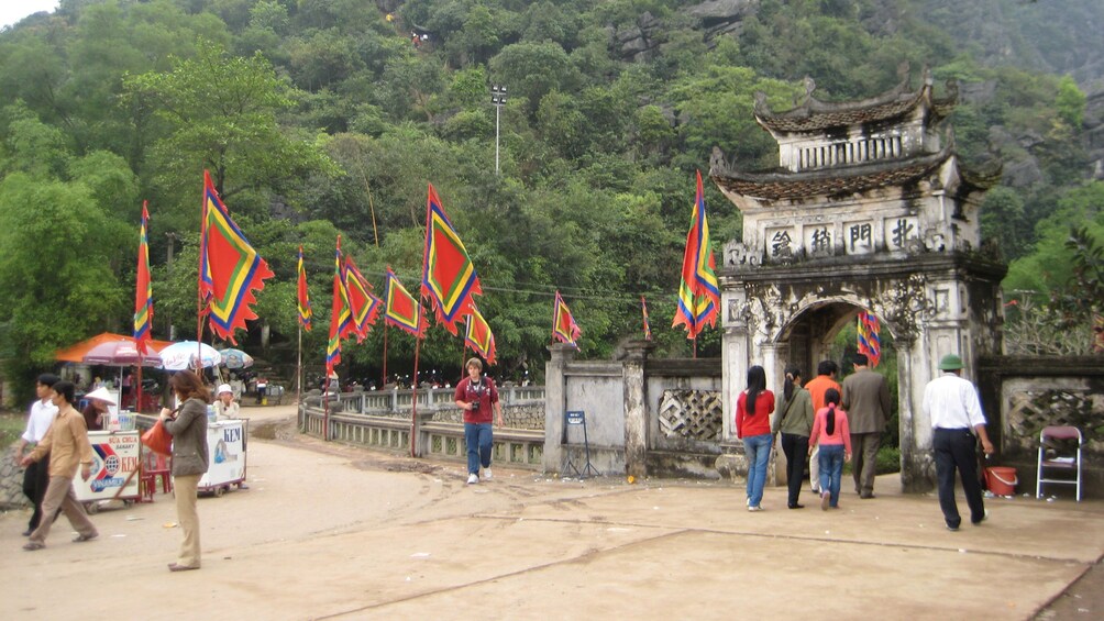walking through an old archway in Vietnam