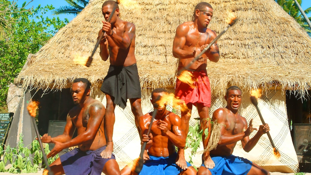 tribesmen performing with torches at Robinson Crusoe Island in Fiji