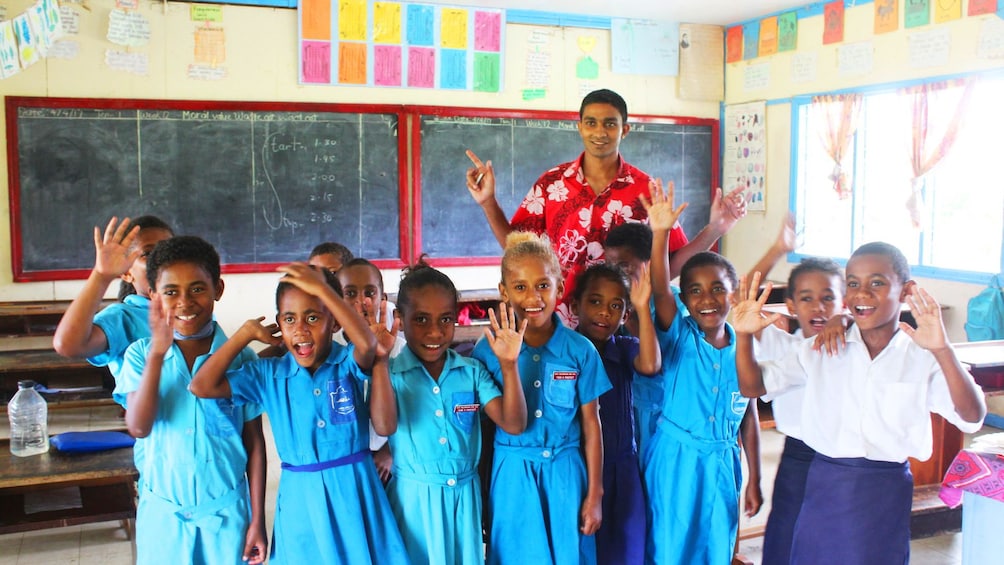 Children in a classroom with Teacher in Fiji