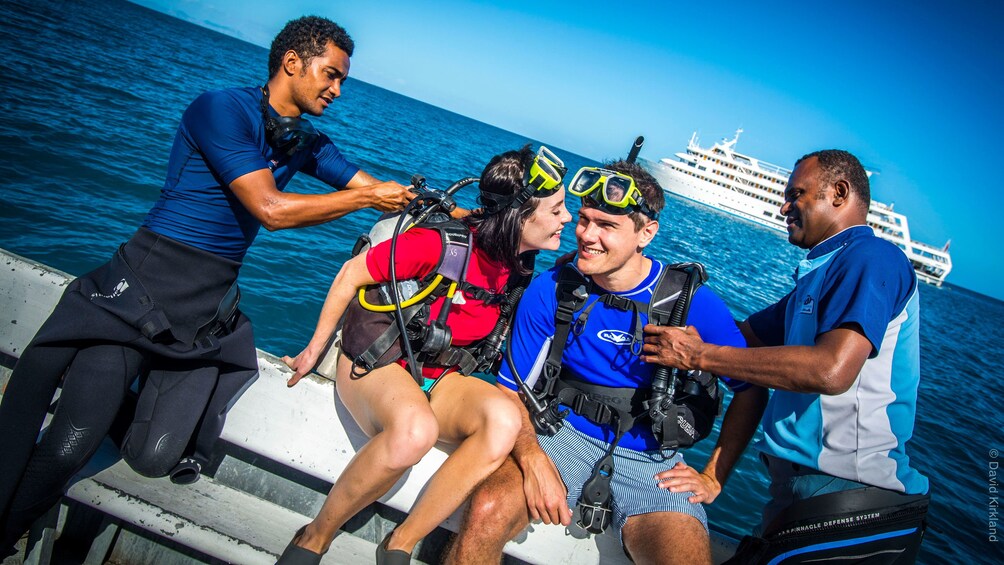 divers suiting up on the boat in Fiji