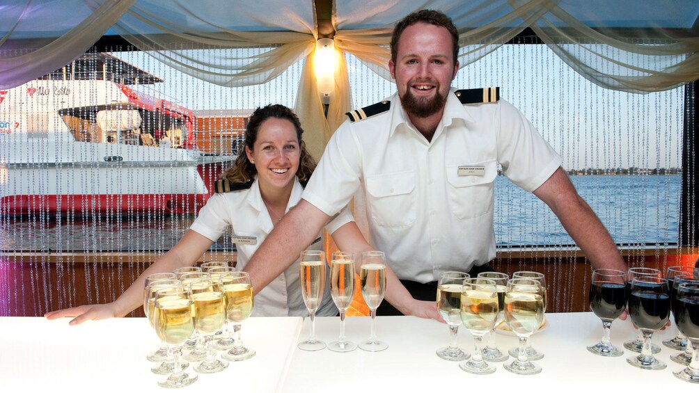 Two crew members serving a variety of local wines from Perth