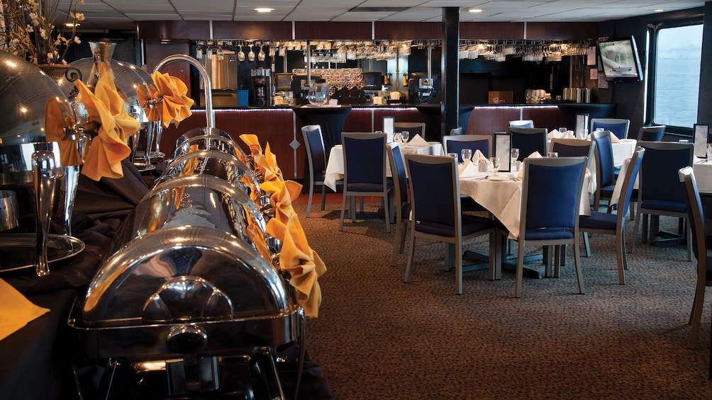 Seating area and food aboard the Spirit of Norfolk Dinner Cruise in Virginia 