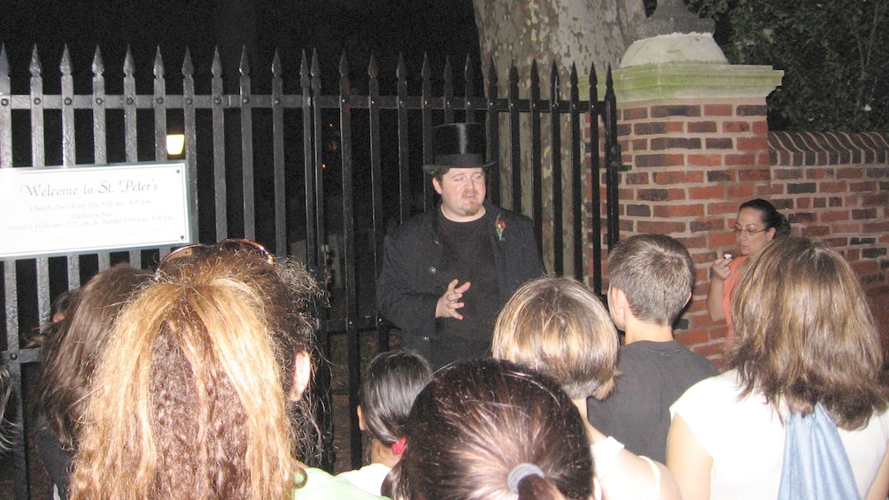 Show item 1 of 5. Ghost Tour at the gates of St Peter's Church at night in Philadelphia
