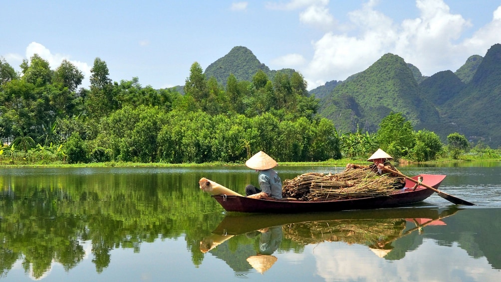 Motorboat in Cái Bè to visit its lively floating market along the Tien River in Vietnam