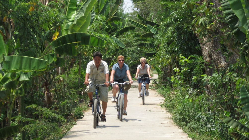 Tourists bicycling on the streets of Vietnam