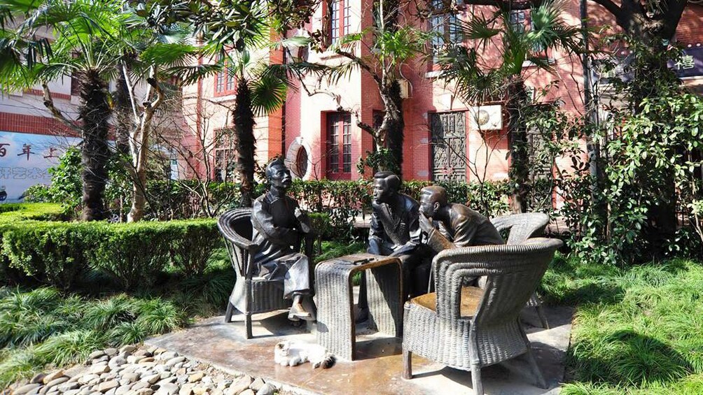 Statue of people sitting around a table at the Duolun Culture Road in Shanghai 