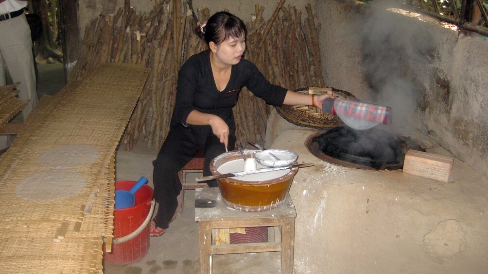 Woman making rice paper in Vietnam 