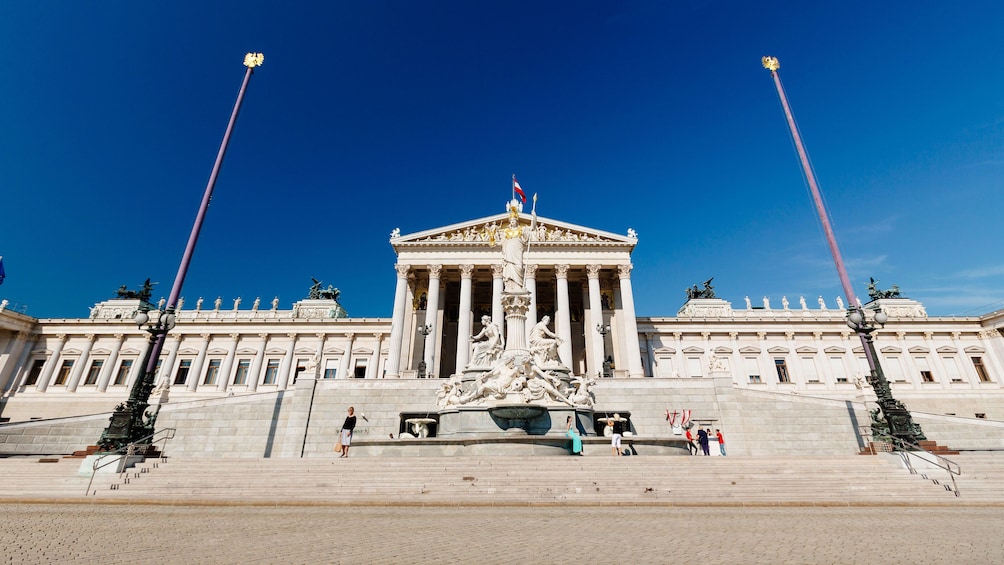 Statue standing in front of the parliament building in Vienna