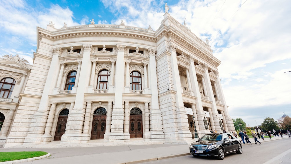 Car waits outside of building in Vienna