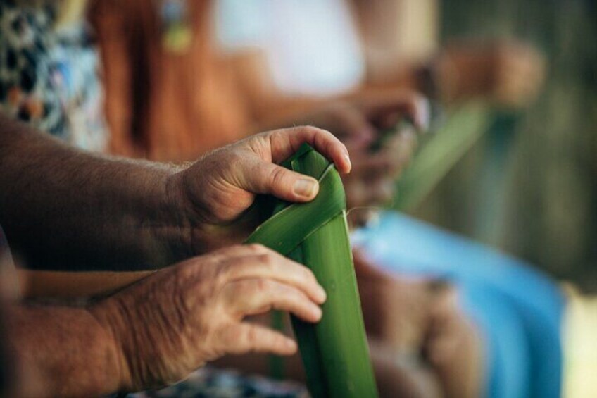 Weave a traditional flower from native flax.