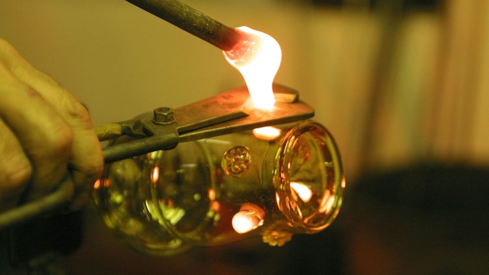 Close up of a torch blowing glass at the Nizbor Glass Factory in Prague