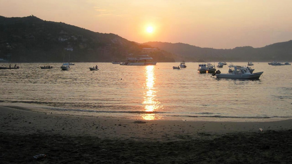 Boats on the water at sunset in Ixtapa