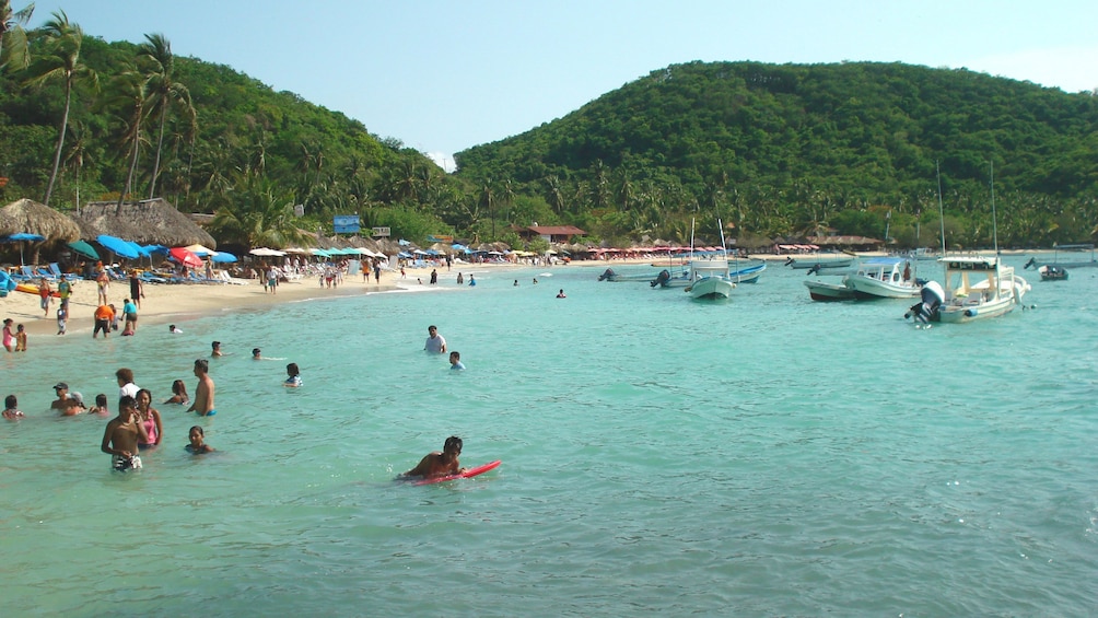 Swimmers along the beach in Ixtapa