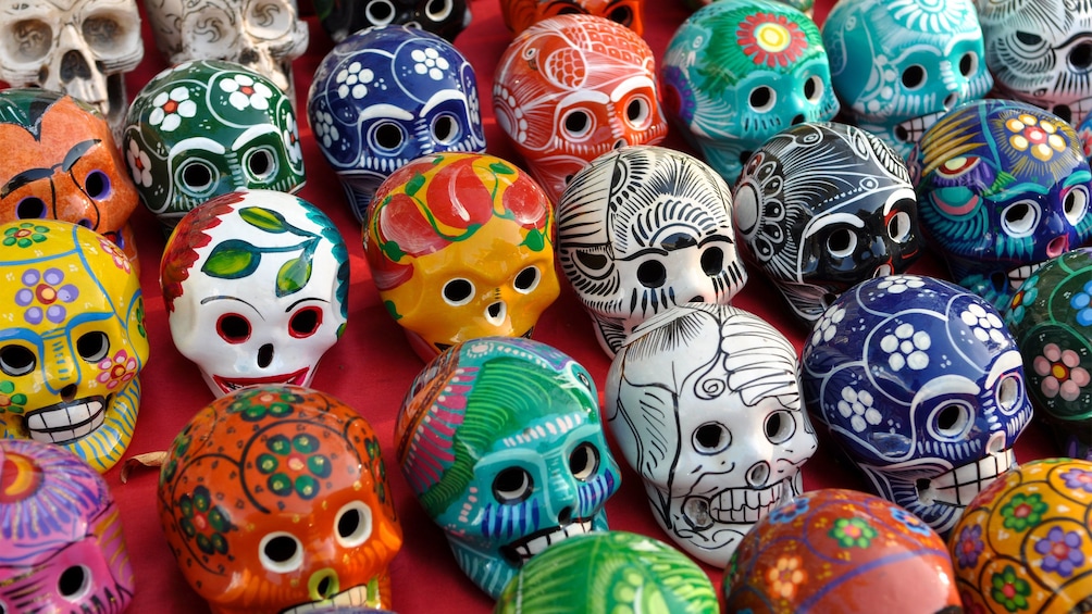 Colorful hand painted skulls at a market