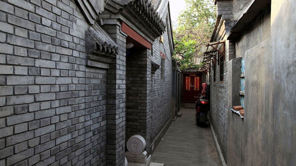 Walking along a narrow alleyway in Beijing