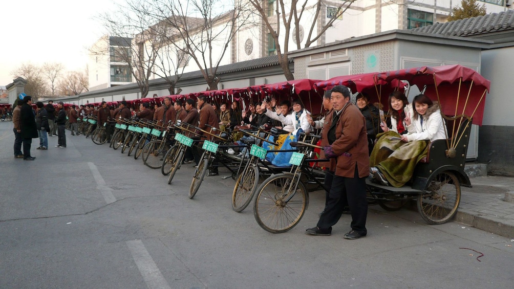 Large group of bike taxis with passengers in Beijing