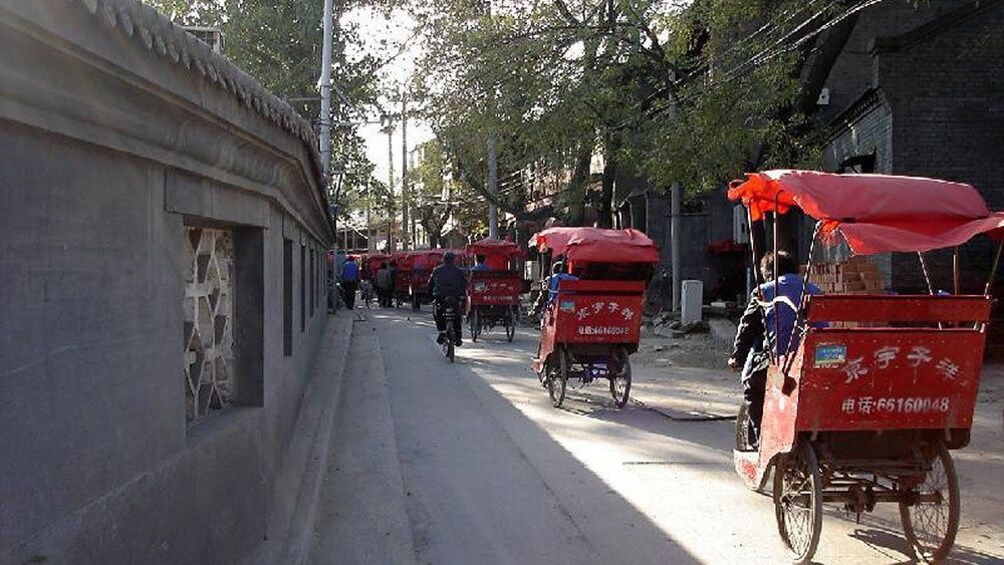 Red bike taxis on the road in Beijing