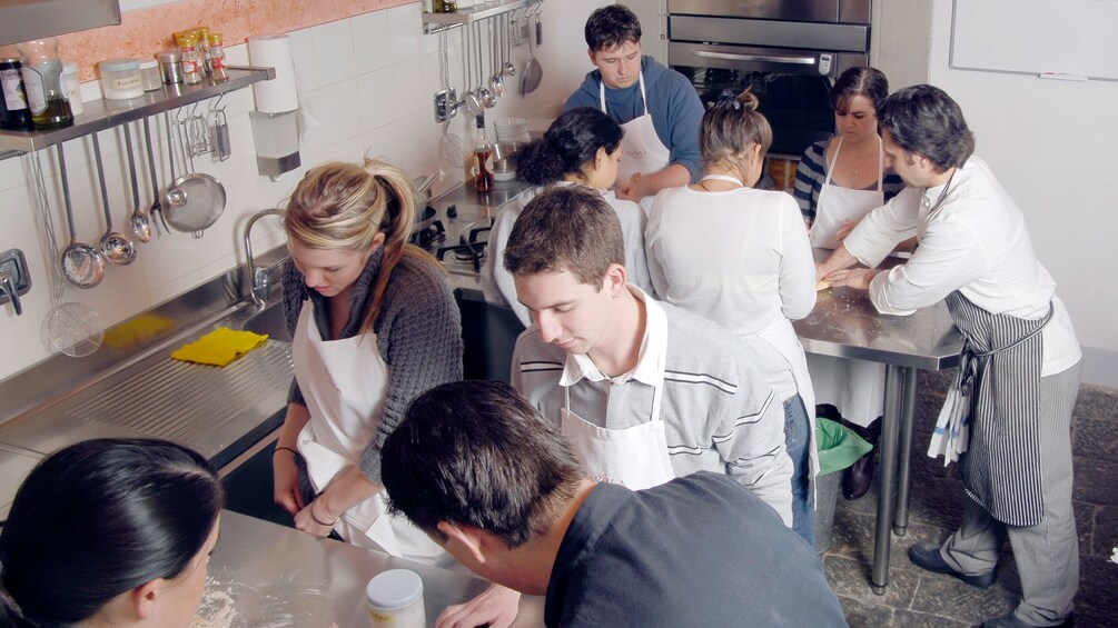 People in kitchen on Cooking Course in Florence Italy